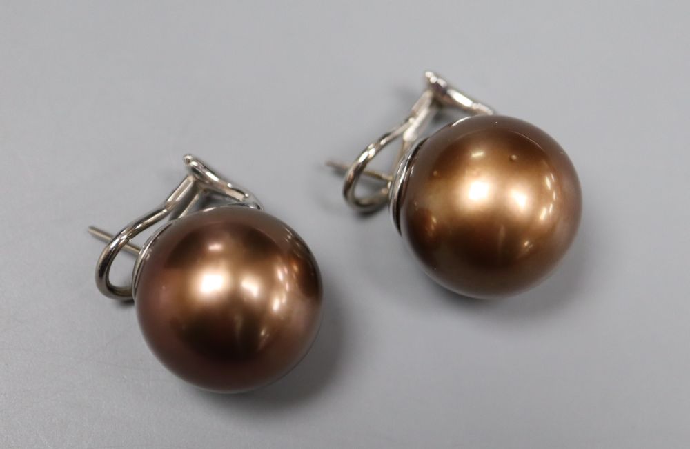 A large modern pair of white metal mounted brown freshwater pearl? earrings, diameter 16.6mm, gross 16.6 grams.